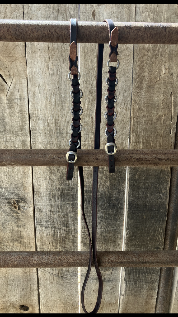 Ring and leather headstall, breast collar and rein