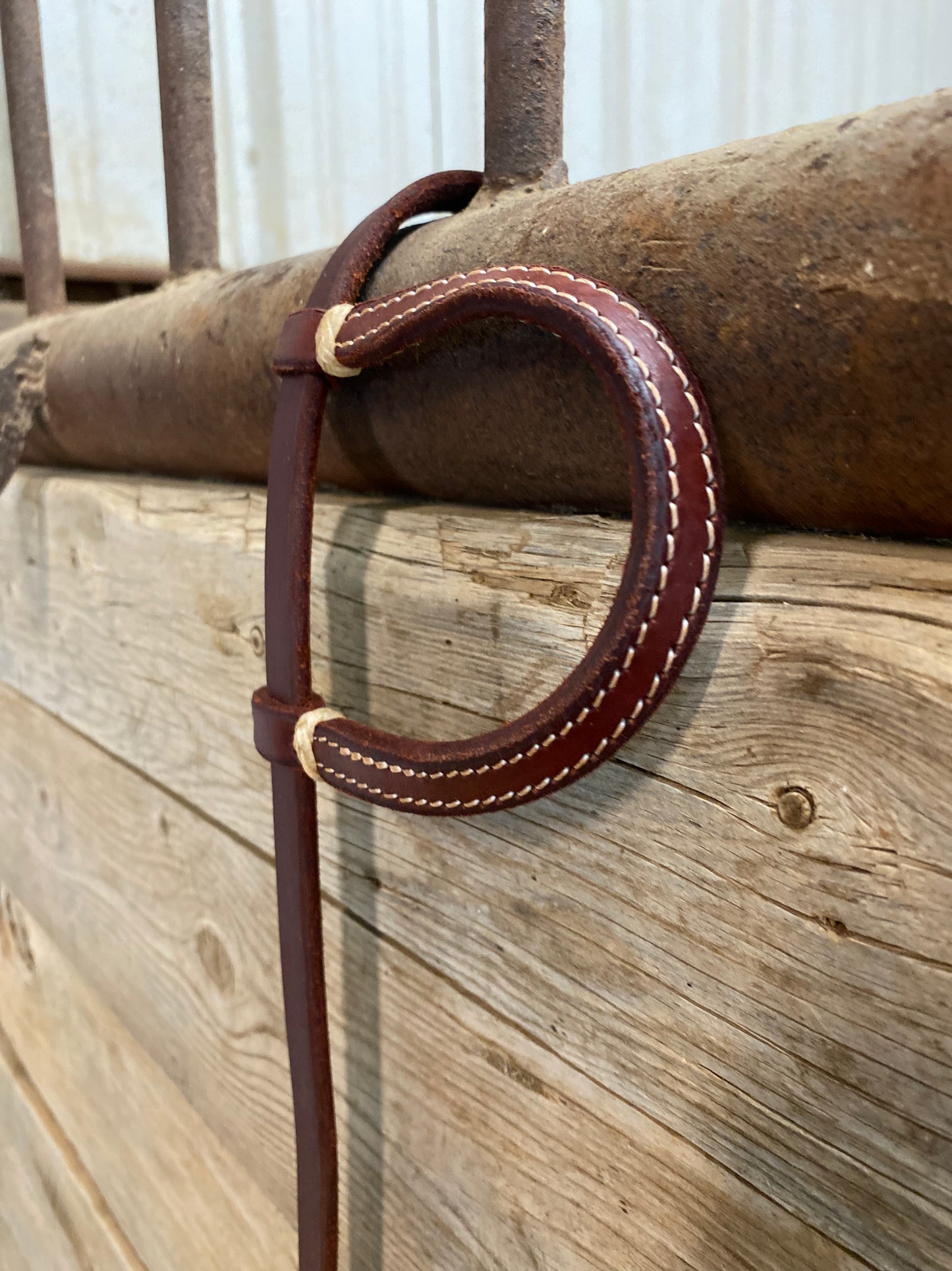 One ear headstall with small rawhide accent pieces